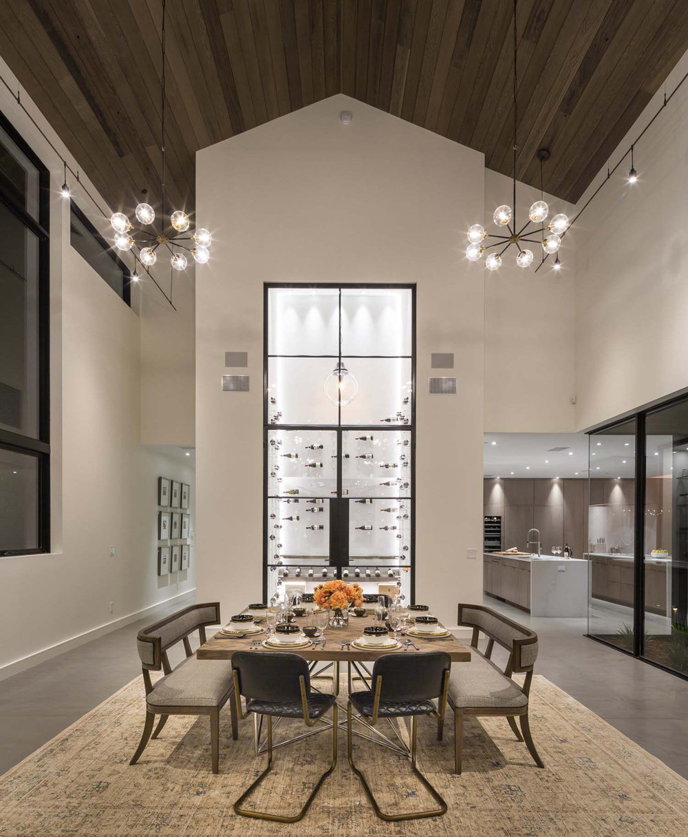Dining room in a large scale modern farmhouse.
