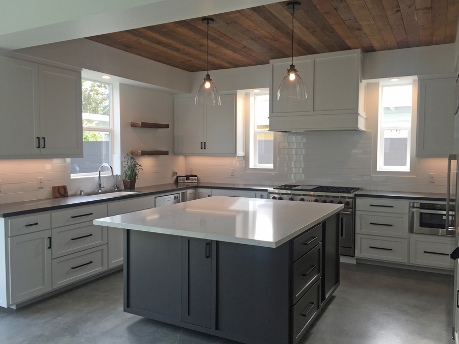 Kitchen in the Palm Modern Farmhouse showing the reclaimed wood on the ceiling.